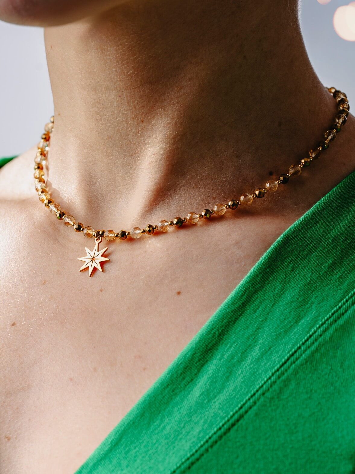 Naszyjnik z cytrynem i złotym hematytem oraz pozłacaną zawieszką gwiazda polarna.